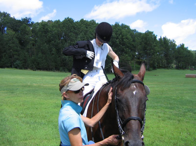 Betsy helping with Godiva while Janna gets ready on a hot day. Otter Creek Dressage Fest, 2010
